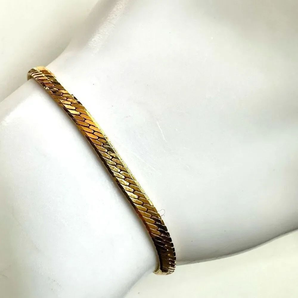 Gold tone herringbone bracelet